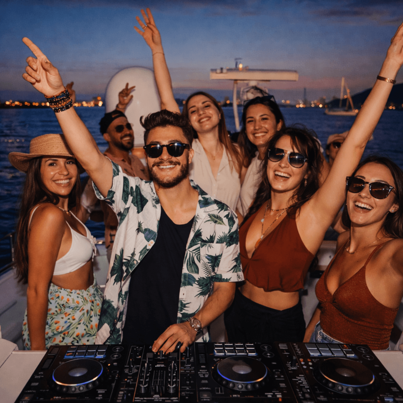 DJ and friends partying on yacht at night